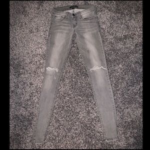 Low rise distressed skinny jeans